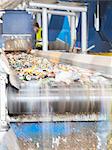 Recycled material on conveyor belt in recycling center