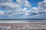 Clouds over ocean at low tide