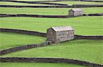 Stone buildings and walls in rural landscape