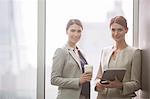 Businesswomen smiling in office