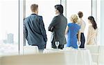 Business people looking out window in restaurant