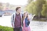 Couple walking along river