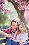 Couple hugging on park bench