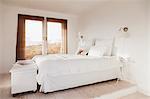 Bed in white bedroom