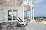 Deck chair on deck overlooking beach