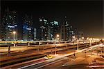 Taxi on city street at night