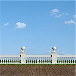 Classic balustrade with pedestal and old wooden floor in a sunny day - rendering