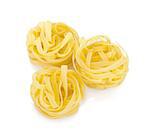 Fettuccine nest pasta. Isolated on white background