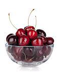 Ripe cherries in a glass bowl. Isolated on white background