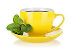 Yellow tea cup with mint. Isolated on white background