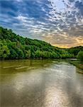 Scenic view of Cumberland River with dramatic sky
