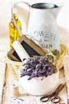 Provence lavender and ceramic mortar on an old wooden board.