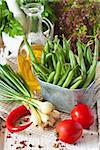 Fresh kitchen garden vegetables on an old wooden board.