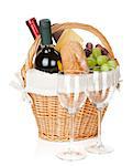 Picnic basket with bread, cheese, grape, wine bottles and two glasses. Isolated on white background