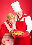 Chef examines a beautiful cherry pie baked by a housewife/student.