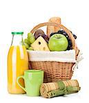 Picnic basket with bread, fruits and orange juice bottle. Isolated on white background