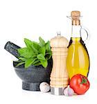 Fresh herbs, spices, olive oil and pepper shaker. Isolated on white background