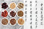 Traditional chinese herbal medicine with mandarin script calligraphy on rice paper over marble. Translation describes the functions to increase the bodys ability to maintain body and spirit health and to balance energy.