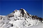 Mount Kazbek at nice winter day. Caucasus Mountains, Georgia, view from ski resort Gudauri.