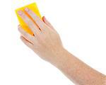 Female hand holding a cleaning sponge isolated on a white