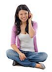 Asian woman talking on smartphone, full body sitting over white background