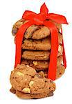 Stack of Delicious Christmas Cookies with Chocolate Pieces and Nuts Tied with Red Ribbon isolated on white background