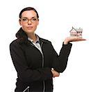 Mixed Race Businesswoman Holding Small House to the Side Isolated on a White Background.