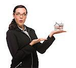 Mixed Race Businesswoman Holding Small House to the Side Isolated on a White Background.
