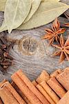 Herbs and spices on old wood table background with copyspace