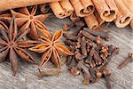 Anise, cinnamon and clove spices on wood table
