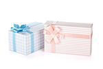 Two gift boxes with ribbon and bow. Isolated on white background