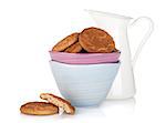 Cookies bowl and milk jug. Isolated on white