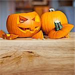 Carving up pumpkins into Jack O Lanterns for Halloween.