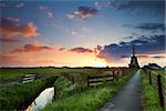 warm spring sunrise behind windmill, Netherlands