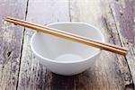 Ceramic white bowl with wood chopsticks