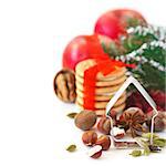 Christmas decoration with cookies, spices and cookie cutter on a white background.