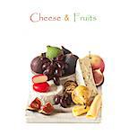 Delicious cheese and ripe fruit on a cutting board.