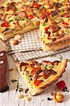 Delicious homemade pie with chanterelle mushrooms and vegetables.