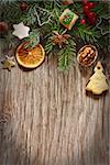 Christmas decoration with cookies and spices on an old wooden background.