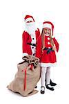 Santa and helper ready for the christmas action holding a large bag