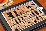 ethics, integrity and principles word abstract - ethical concept on a digital tablet with a cup of tea