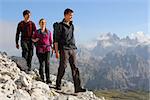 Young people hiking in the mountains Alps Italy
