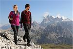 Young couple hiking in the mountains Alps Italy