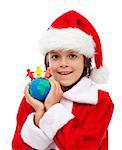 Merry christmas for all the world concept - child holding clay figure earth and people