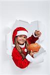 Little santa girl saving for christmas presents - looking through hole in paper, with copy space