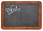 new word- white chalk text  on a vintage slate blackboard