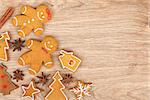 Homemade various christmas gingerbread cookies on wooden background