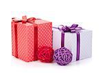 Colorful gift boxes with ribbon and bow and christmas decor. Isolated on white background