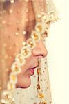Traditional  happy Indian bride with a beautiful smile,  covered her face by veil