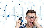 Composite image of frustrated computer engineer screaming while on call in front of blue ecg line